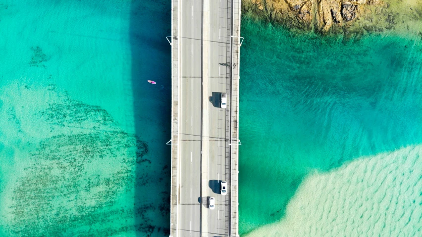 two vehicles drive over an open highway