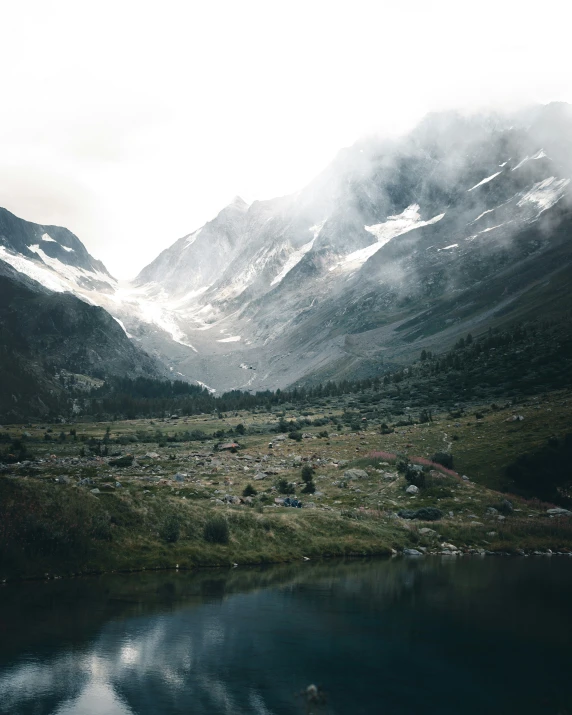 a mountain with mountains and water near it