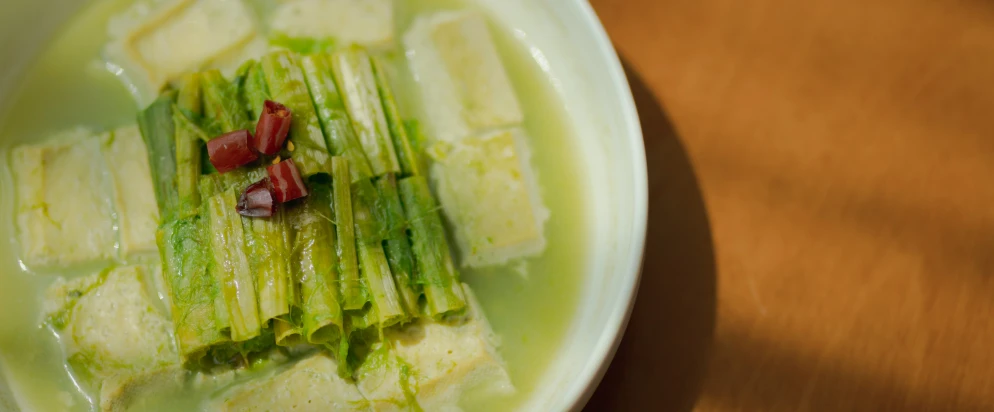 plate with green vegetables, cut up and placed on it