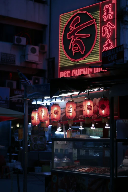 an asian food stand with various items in it