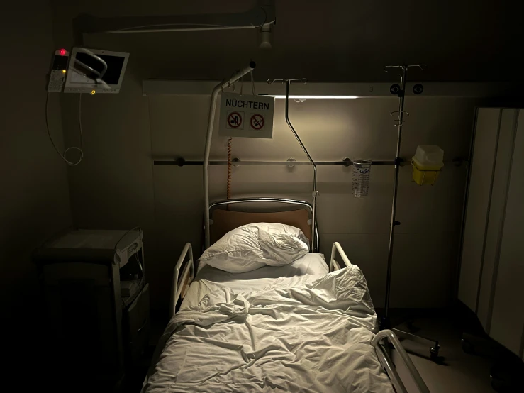 a person in bed is connected to an oxygen tube