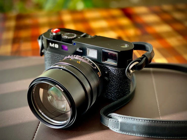 a digital camera and a tripod are sitting on a table