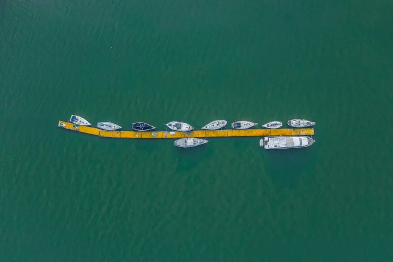 three boats floating in a body of water