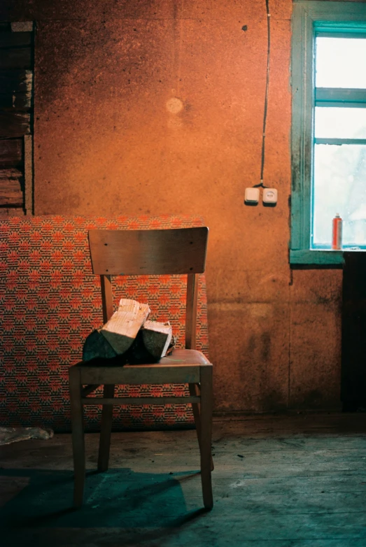 a chair is sitting in a dilapidated room