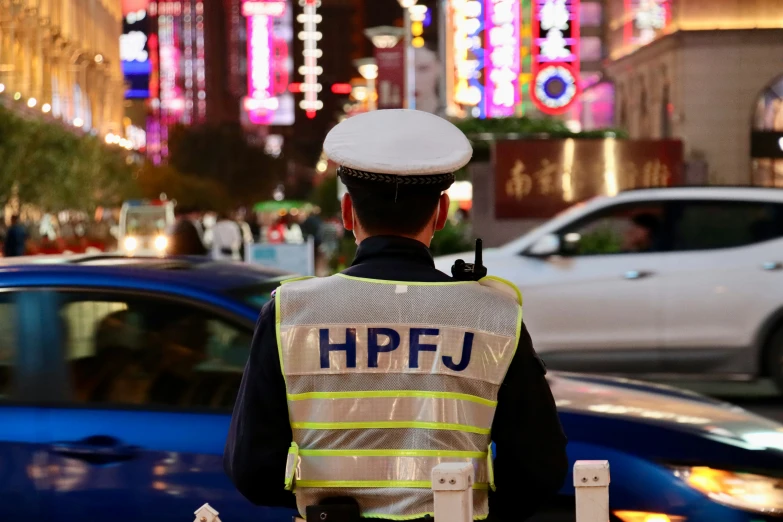 a police officer standing on the side of the road