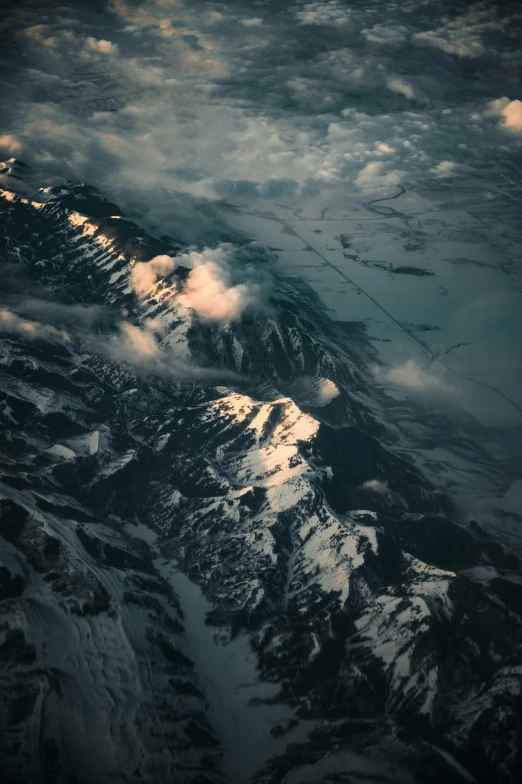 snow capped mountain under a cloudy sky