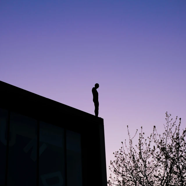 a man standing on top of a building