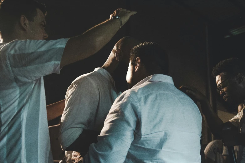 two men standing together while the crowd looks on