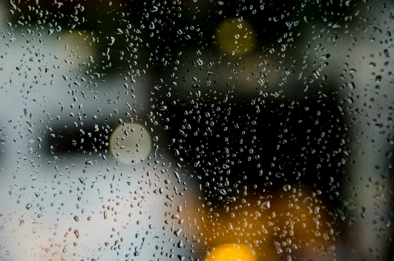 water droplets are falling on the window pane