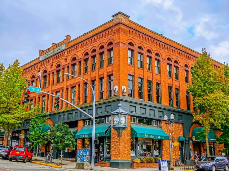 a large red brick building sitting in the middle of a street