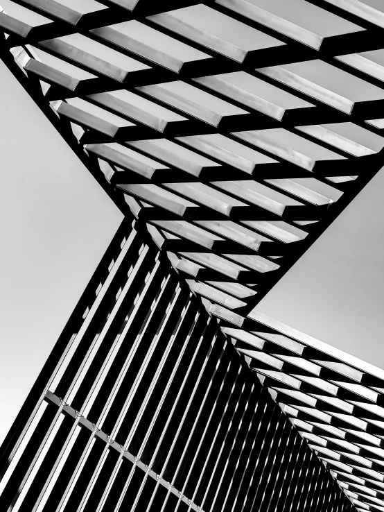 a black and white po shows the top of a metal structure