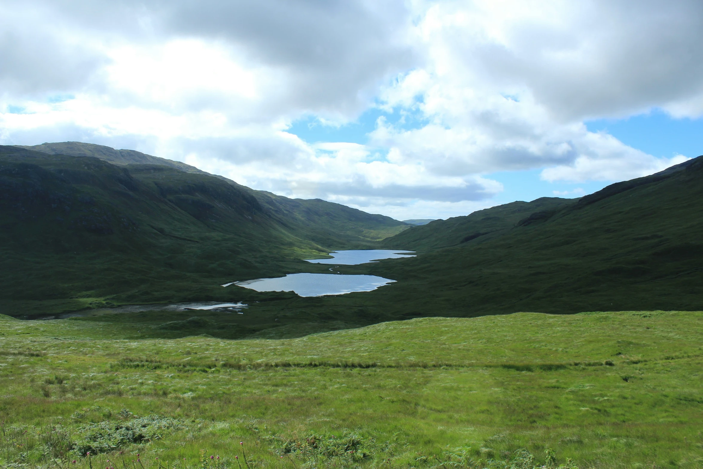 a picture of the top of hills overlooking the lake