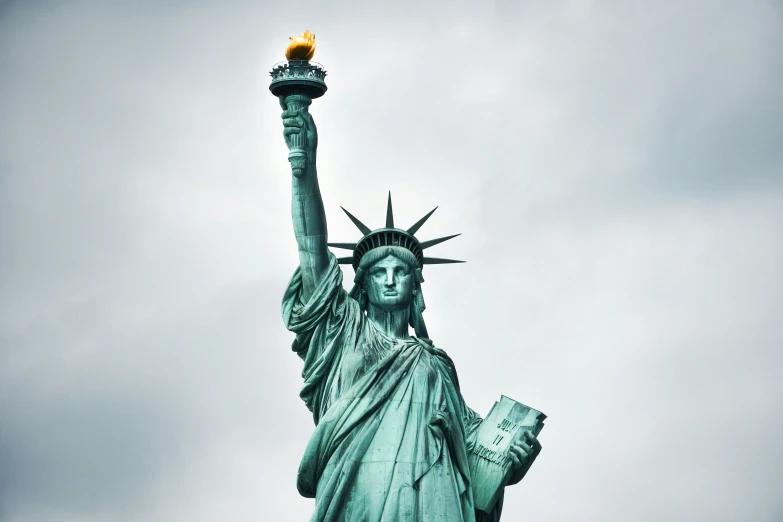 the statue of liberty has its torch on top