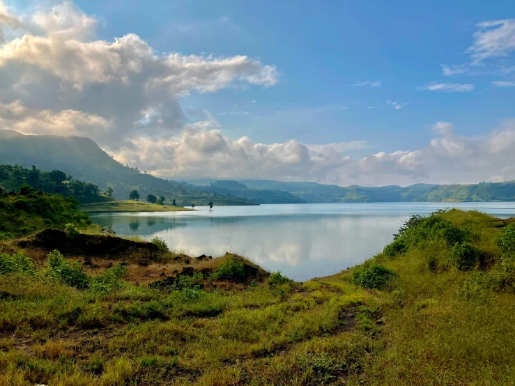 a beautiful lake with mountains in the background