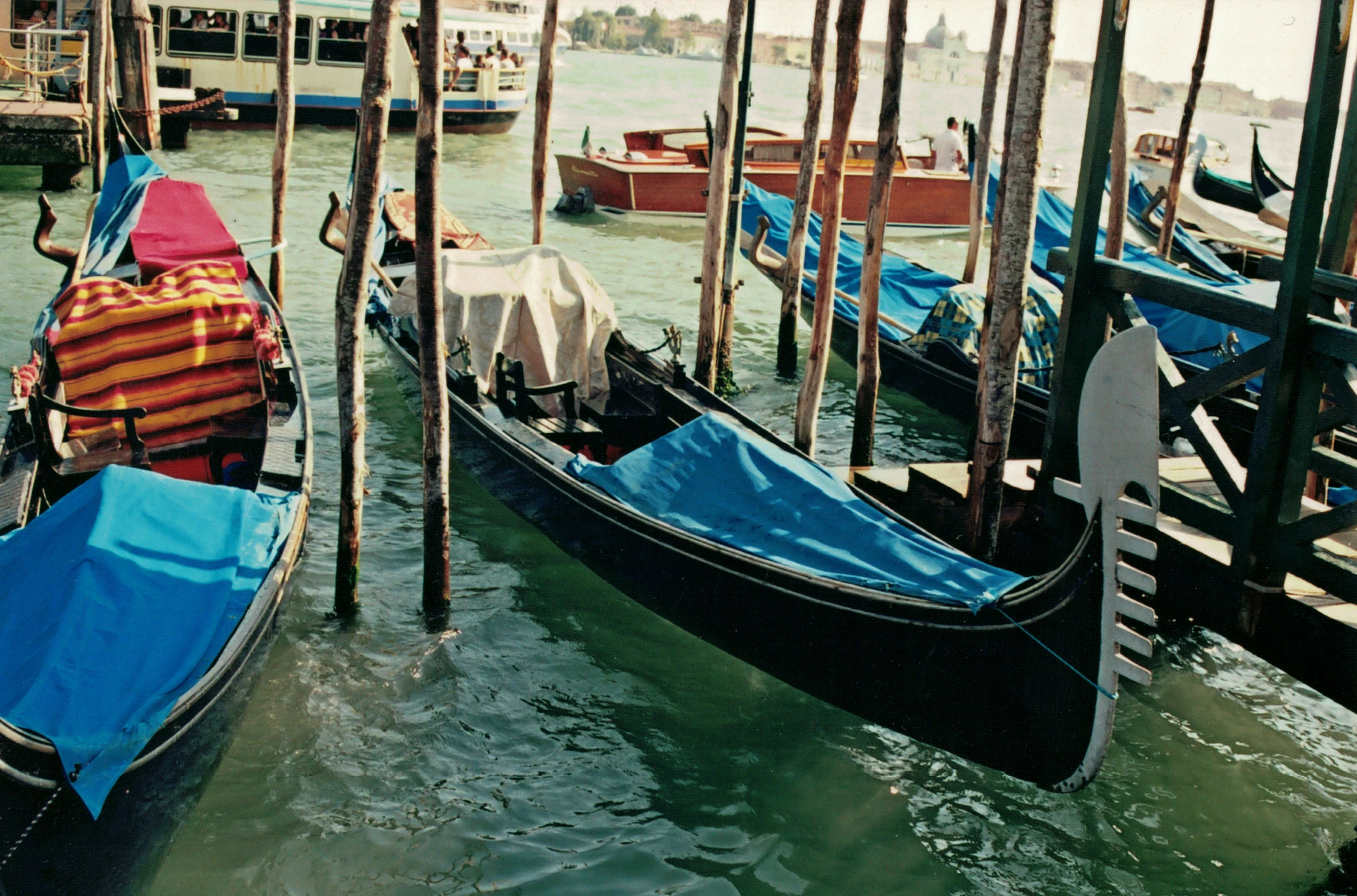 a number of boats near a dock on a body of water