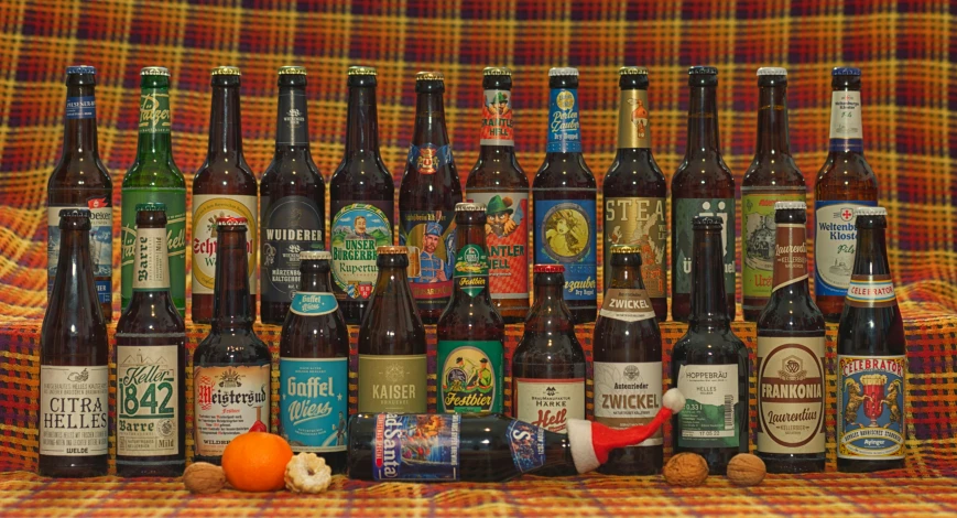 a number of different bottles of beer on a couch