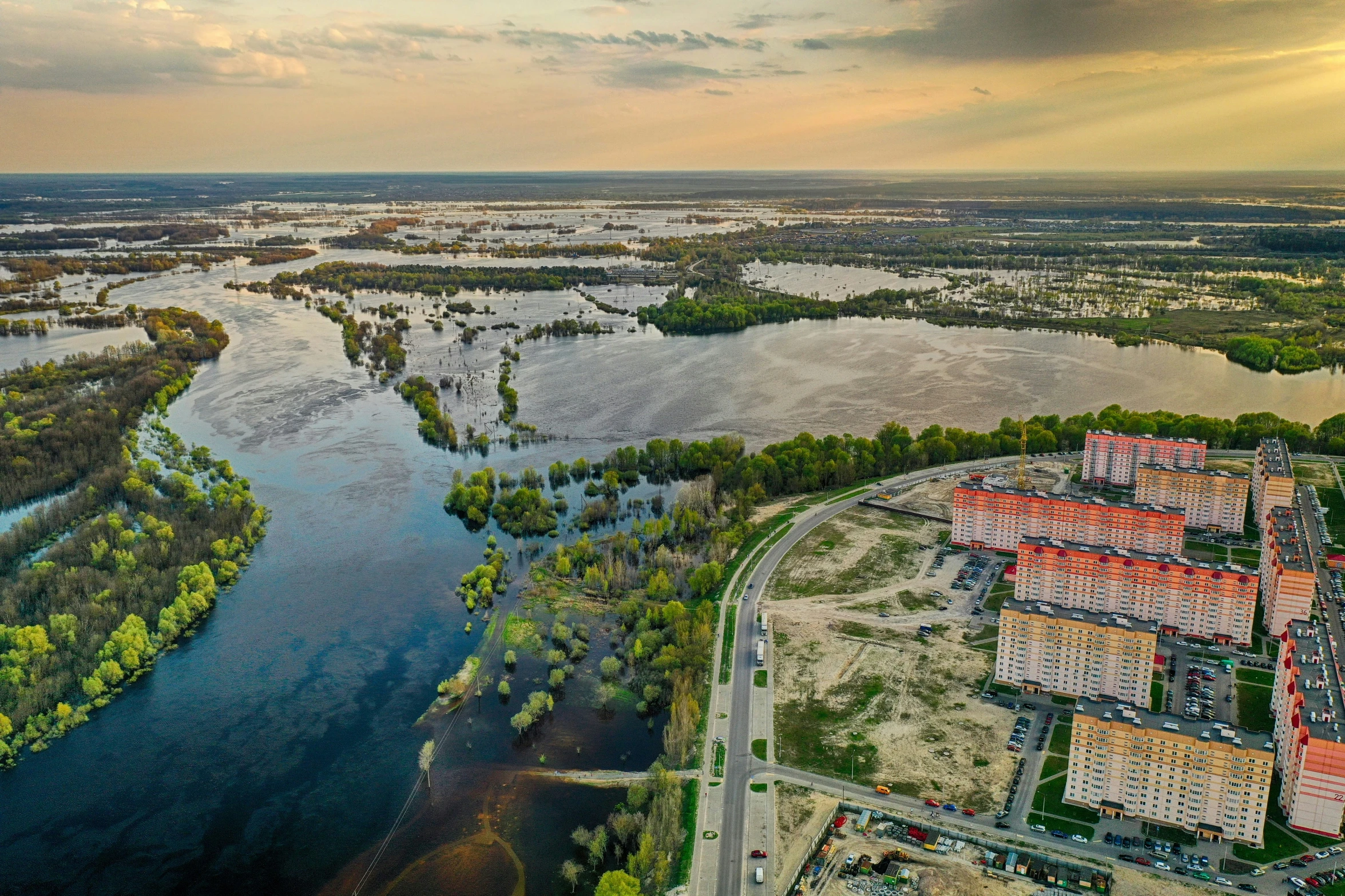 an aerial view of a large river and buildings