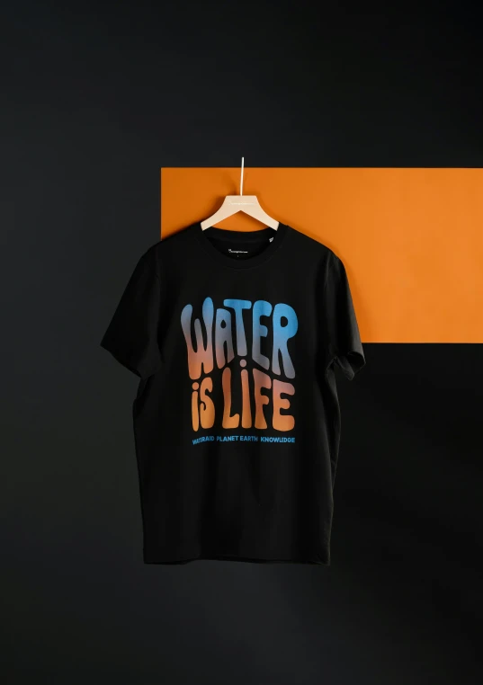 t - shirt with'water is life'on it hanging on a wall