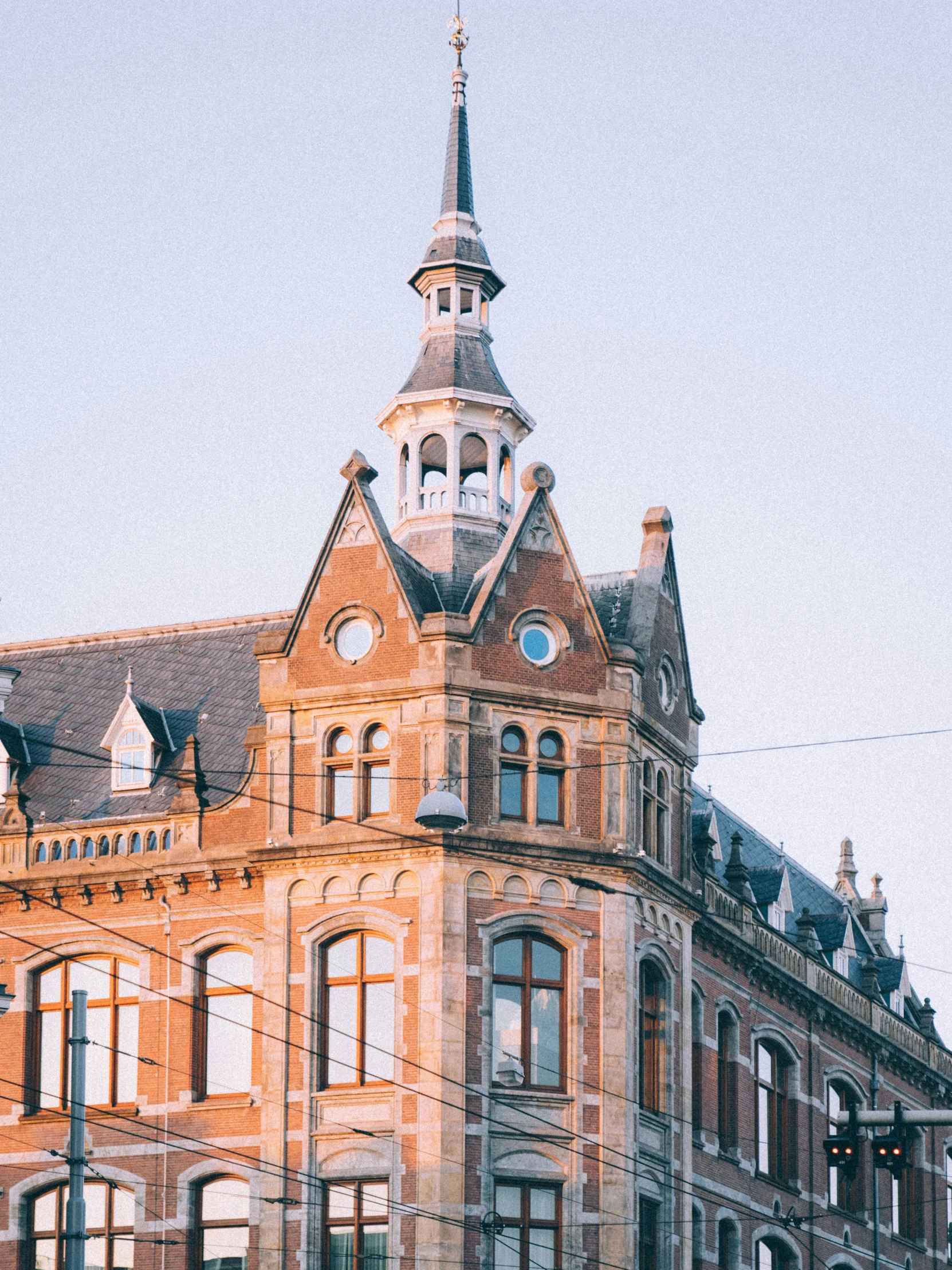 large brick building with clocks mounted on the top