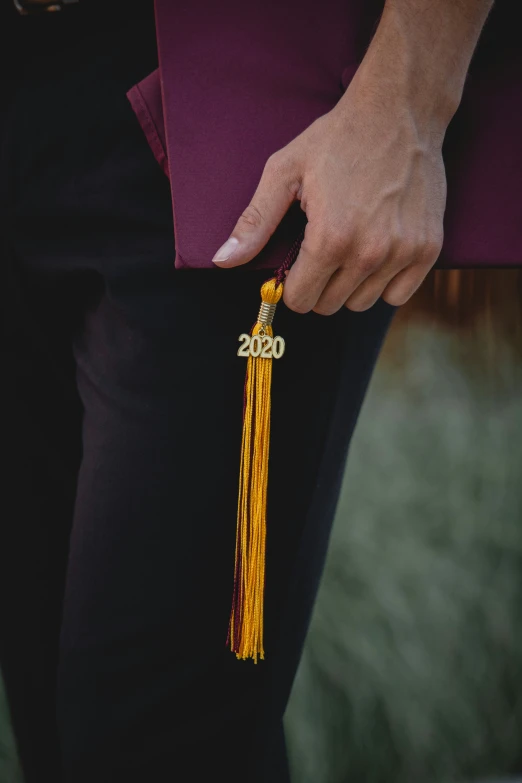 a person with an arm tassels holding a piece of material