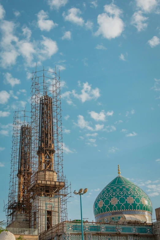 an ancient building with scaffolding around it