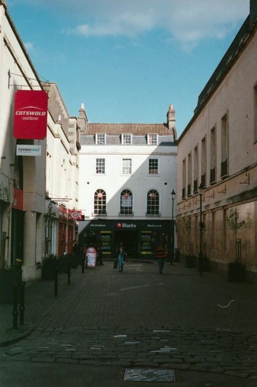 a large city street with a tall white building