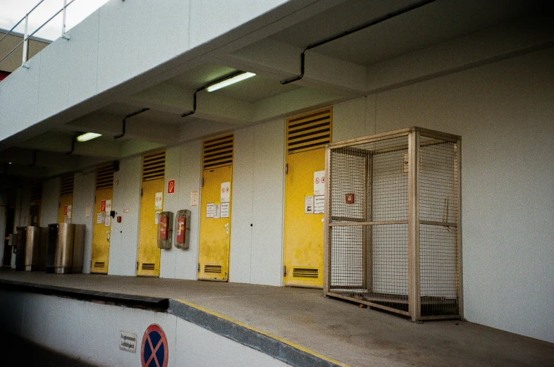 many yellow shutters in a white building