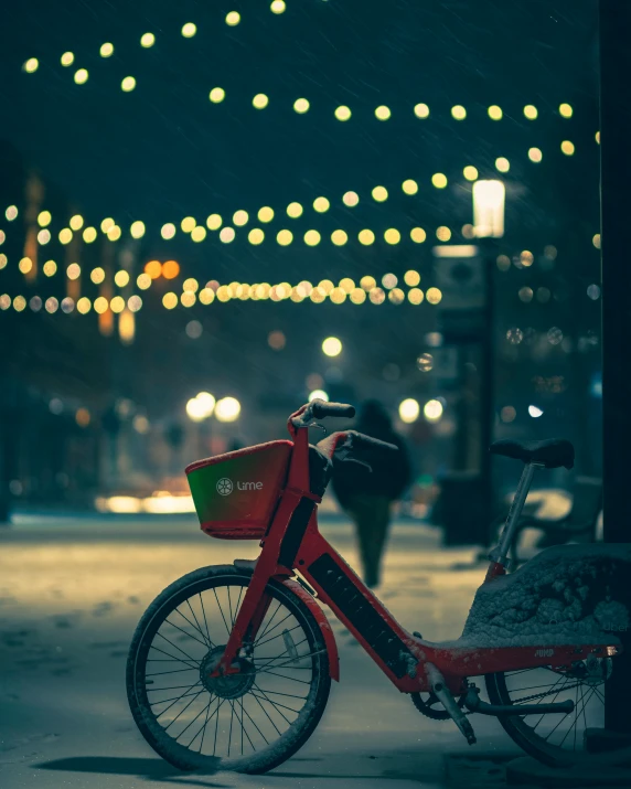 a red bicycle parked on the side of a street