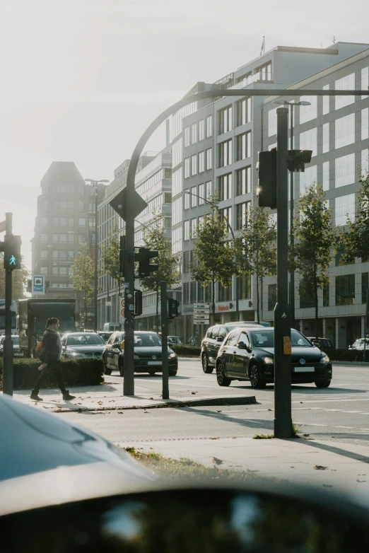 city street with cars on it near the light pole