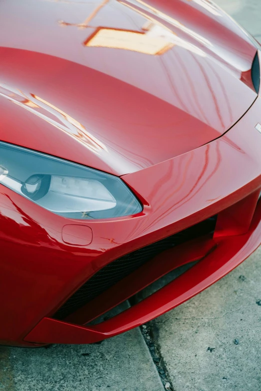 close up of the front bumper of a red sports car