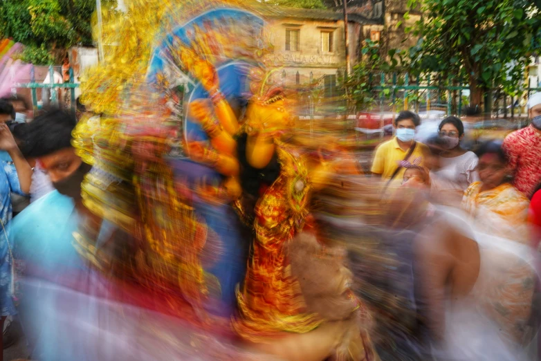 people walking in front of a crowd are blurred