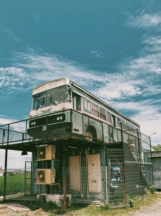 an old building with a train car attached to it