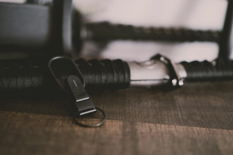 black metal clip and an empty silver carabine