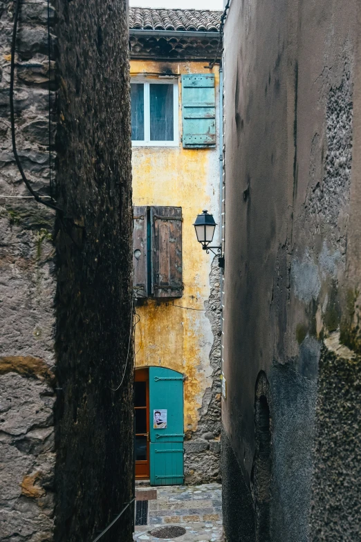 a door is opened in a small alley