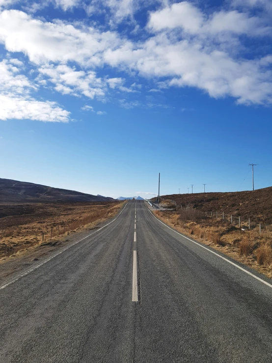 a very empty road in the middle of nowhere