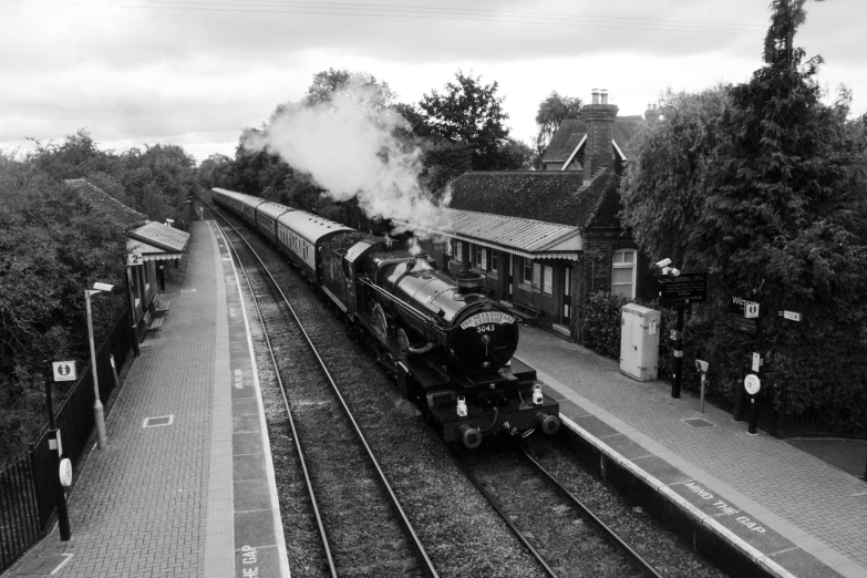 a train passing by a small village in the evening