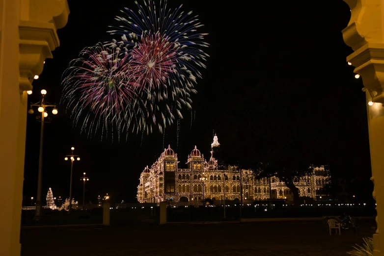 fireworks in the dark over a large building