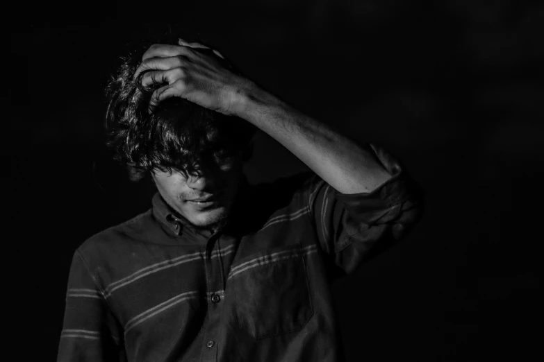 black and white po of a man wearing a polo shirt