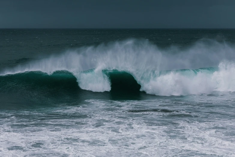 a huge ocean wave coming in on a big one