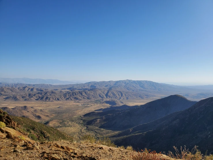 a vast mountain range in the middle of a sunny day