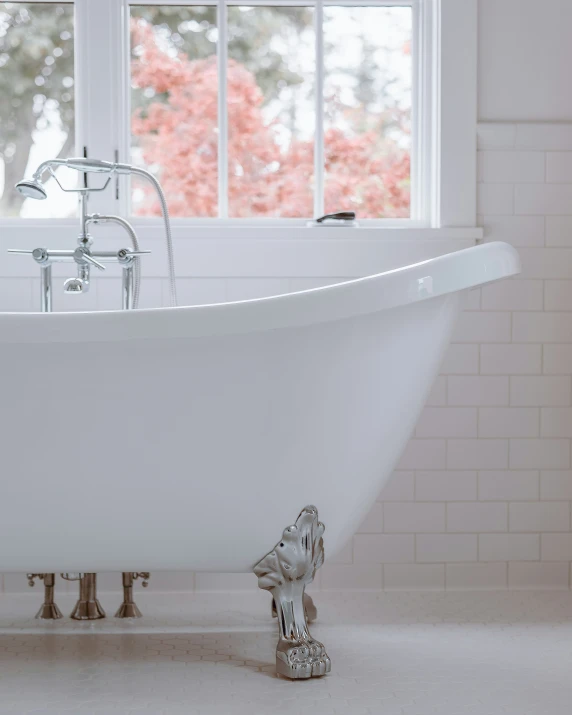 a white tub that has two faucets in it