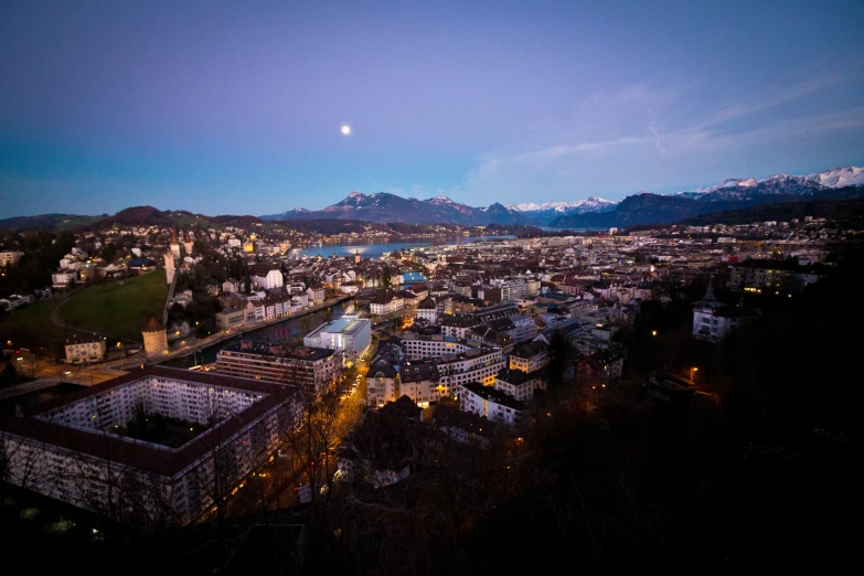 view of a city and mountains from above at night