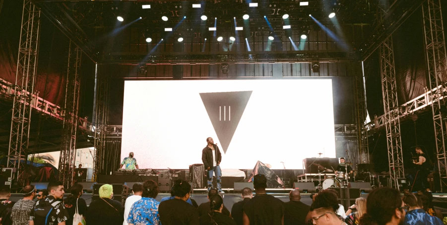 a group of people standing on top of a stage