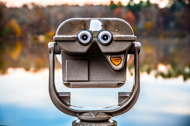 a peephoid camera overlooking a lake in a park