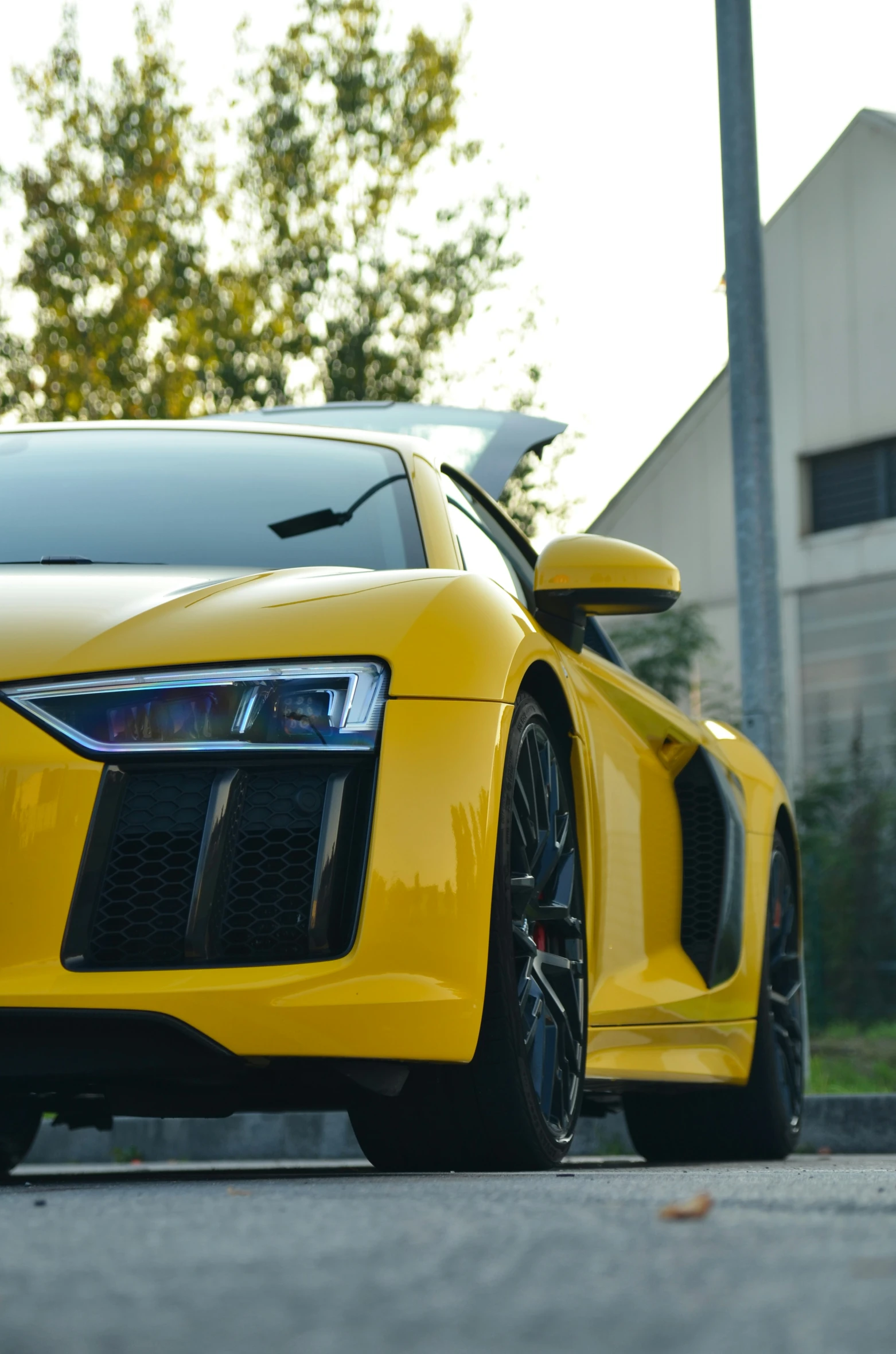 a yellow car parked in front of a building