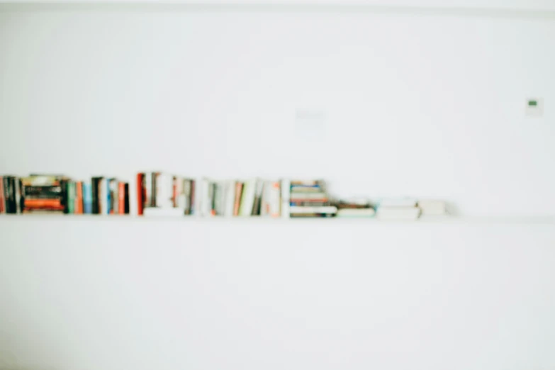 several books on a bookshelf in a room