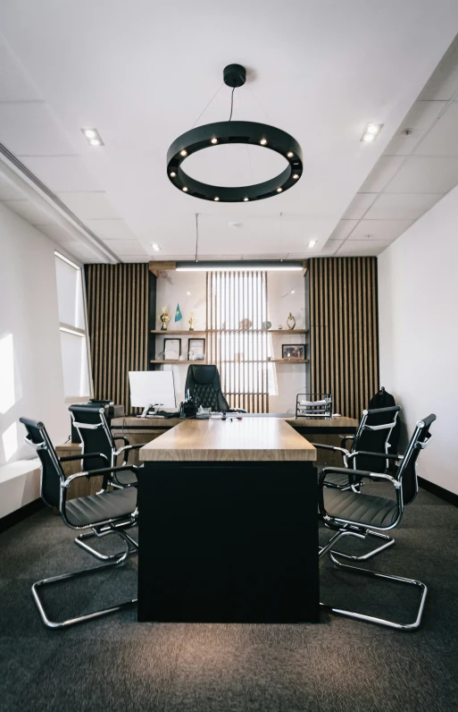 the view of an office with lots of furniture