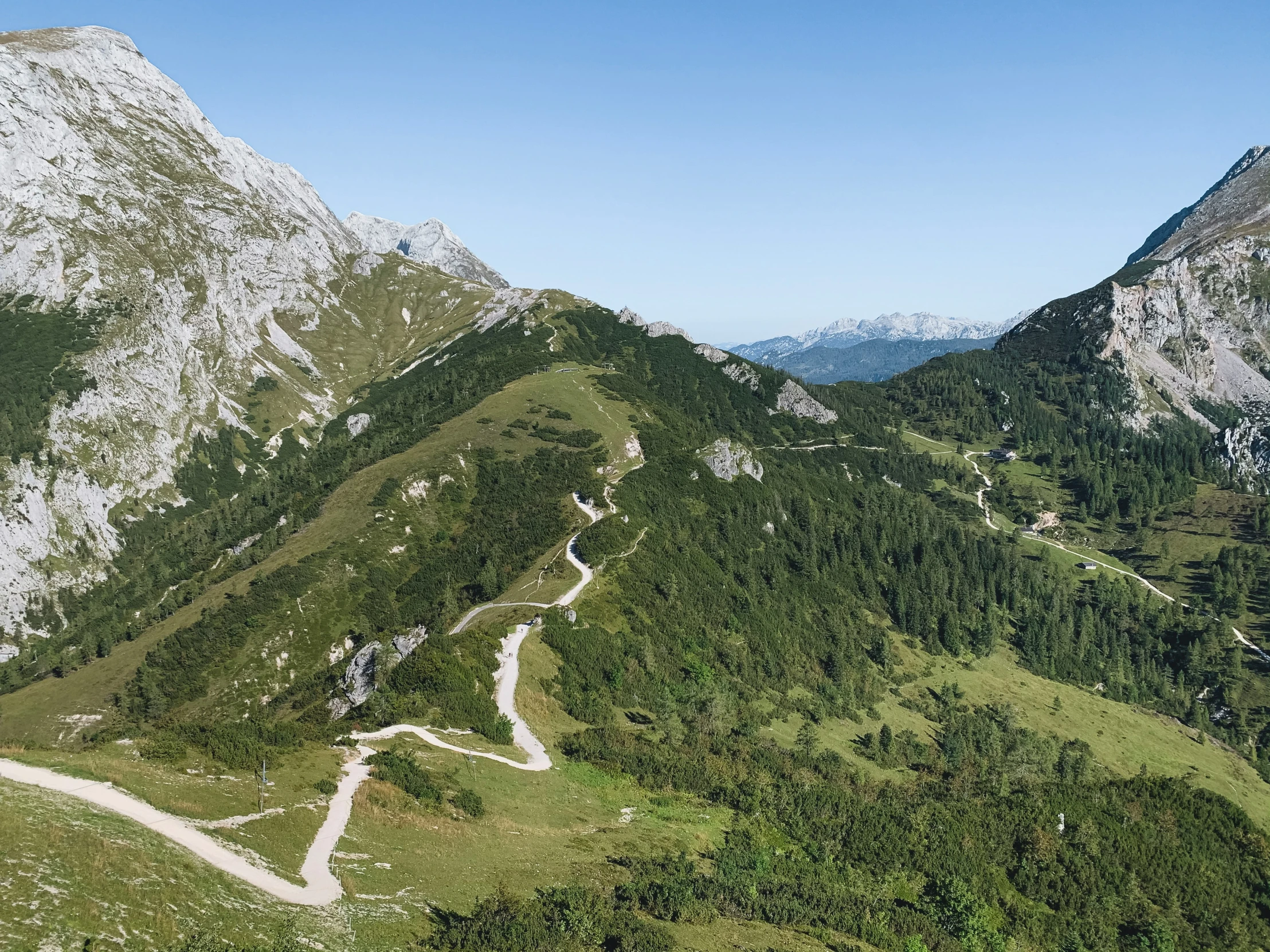 view from a hill of a mountain with a winding road