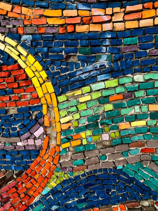 this colorful wall is made from different types of colored tiles