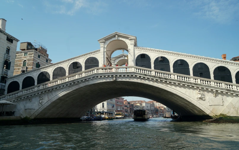 the arch of a bridge over a waterway